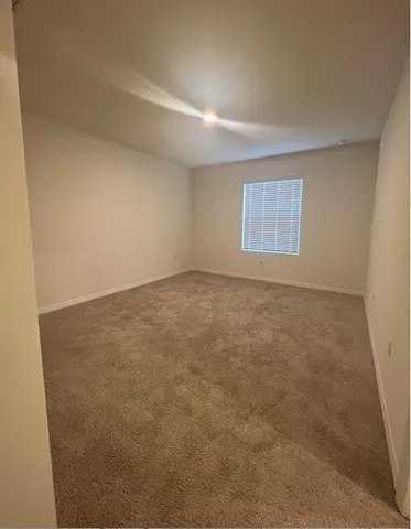 an empty room with a windows