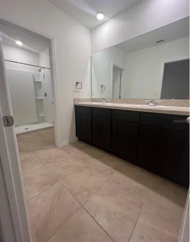 a room with a cabinets and a sink