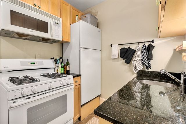 a kitchen with a stove and a microwave