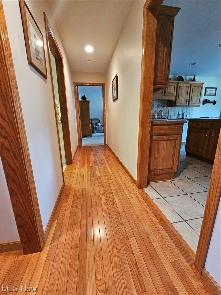 5120 Pierce Road Northwest Warren, OH 44481 - Photo 22 of 35 Corridor featuring light hardwood floors