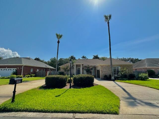 a front view of a house with yard table and chairs