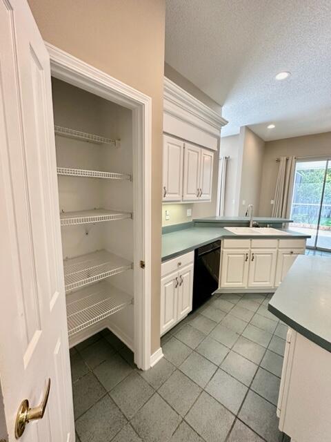 2024 Grayson Drive Navarre, FL 32566 - Photo 11 of 47 a large white kitchen with a stove top oven sink and cabinets