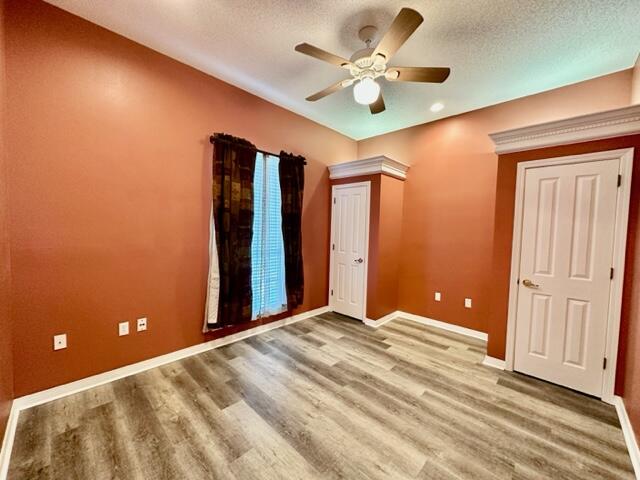 2024 Grayson Drive Navarre, FL 32566 - Photo 24 of 47 a view of a livingroom with a chandelier fan and wooden floor