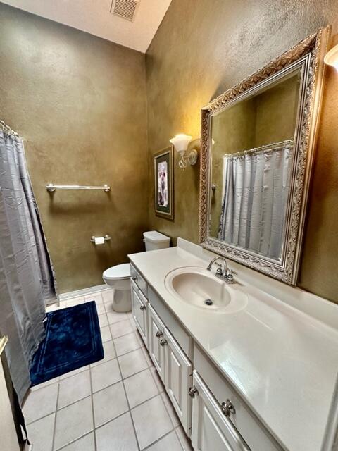 2024 Grayson Drive Navarre, FL 32566 - Photo 28 of 47 a spacious bathroom with a granite countertop sink a toilet a mirror and bathtub