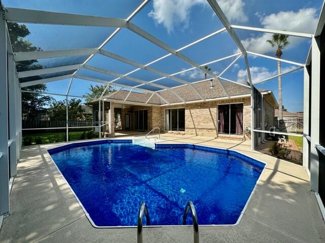 2024 Grayson Drive Navarre, FL 32566 - Photo 35 of 47 a view of a house with swimming pool