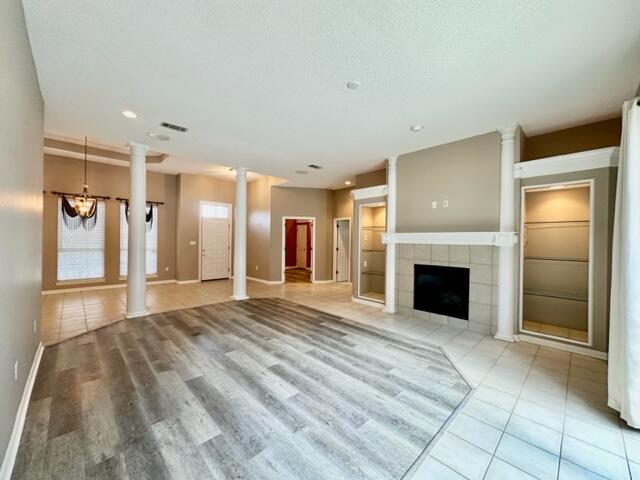 2024 Grayson Drive Navarre, FL 32566 - Photo 6 of 47 a view of an empty room with a fireplace and a window