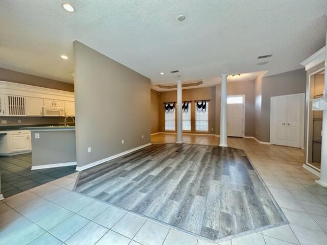2024 Grayson Drive Navarre, FL 32566 - Photo 7 of 47 a view of a hallway with wooden floor
