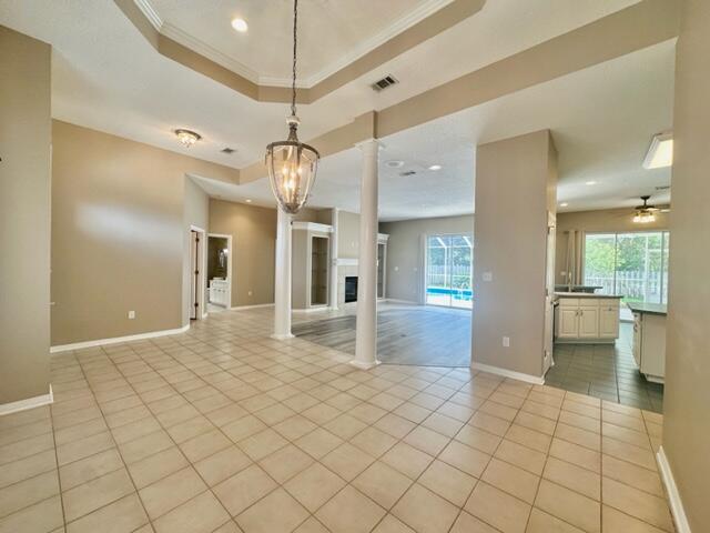 2024 Grayson Drive Navarre, FL 32566 - Photo 47 of 47 a view of a hallway with wooden floor and a chandelier