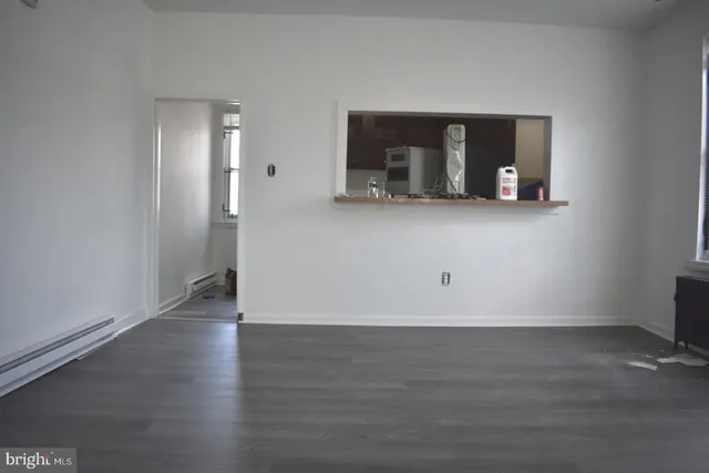 a view of a living room with wooden floor