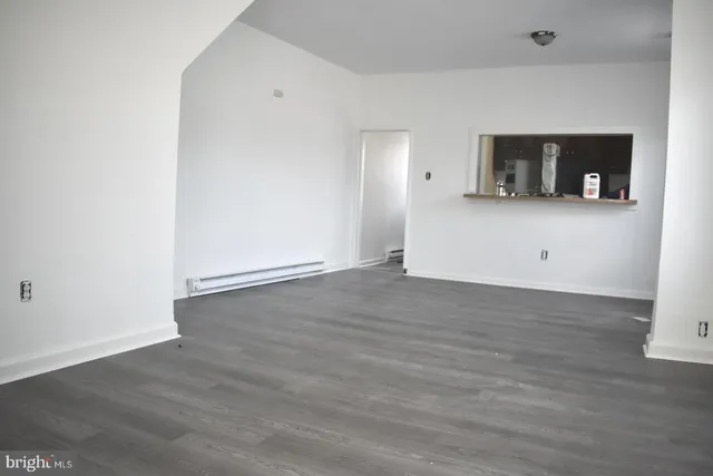 a view of a livingroom with wooden floor