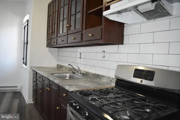 a kitchen with a stove and a microwave