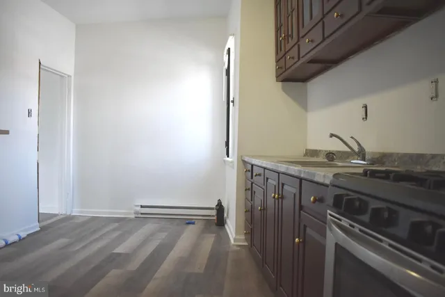 a kitchen with a sink and cabinets
