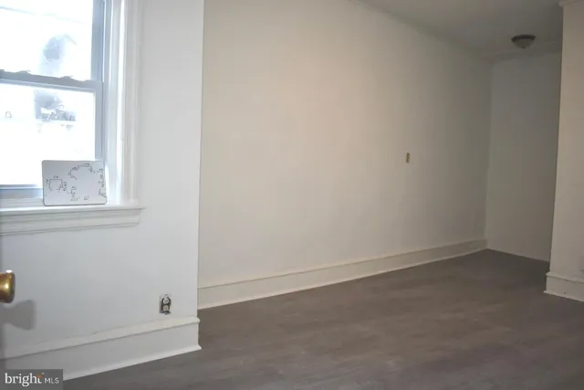 an empty room with closet area