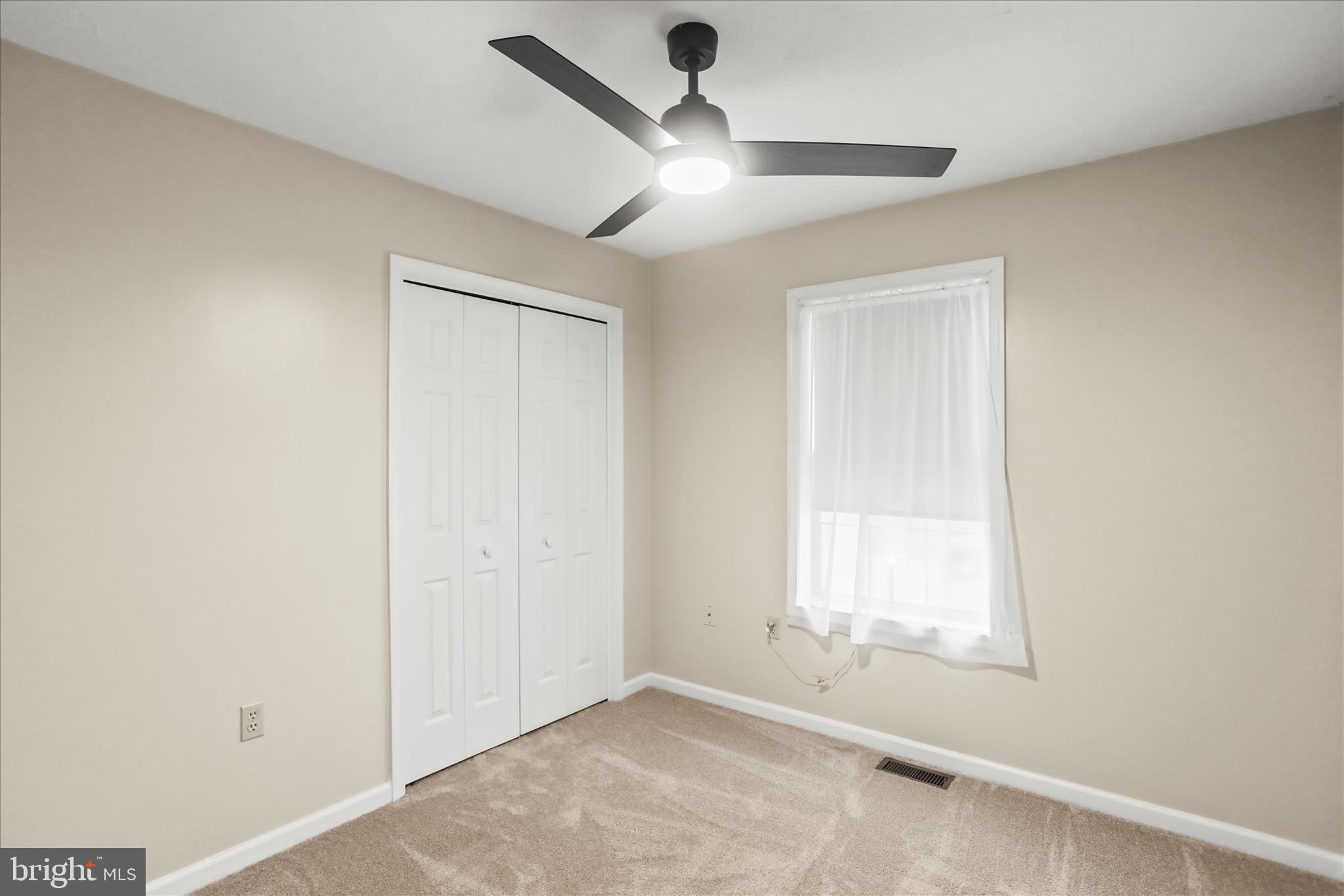 8 Magnolia Lane Hanover, PA 17331 - Photo 23 of 38 an empty room with a window and a ceiling fan