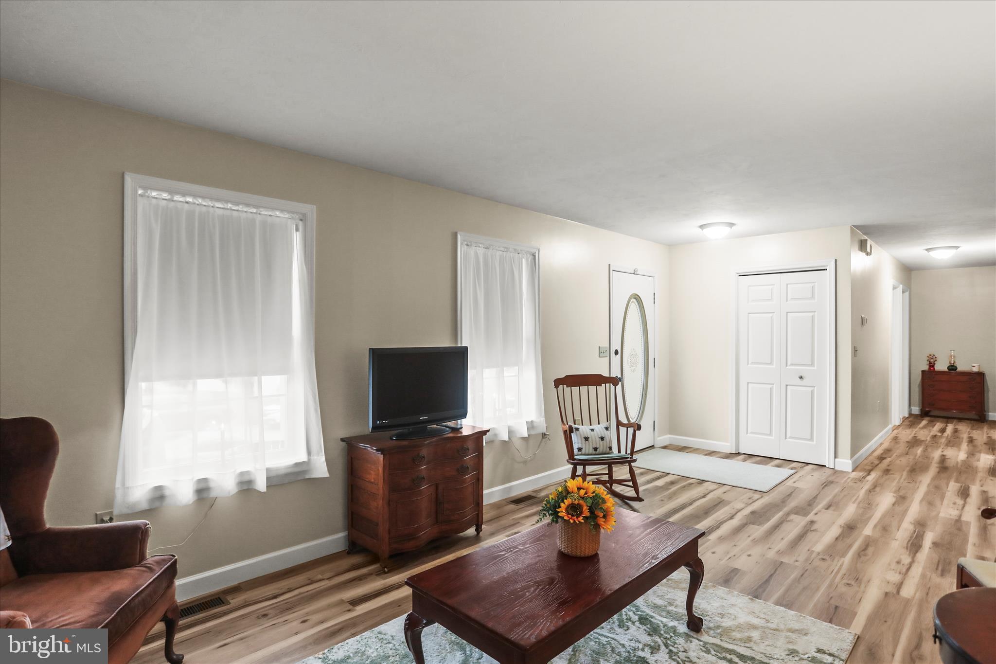 8 Magnolia Lane Hanover, PA 17331 - Photo 8 of 38 a living room with furniture a flat screen tv and a window