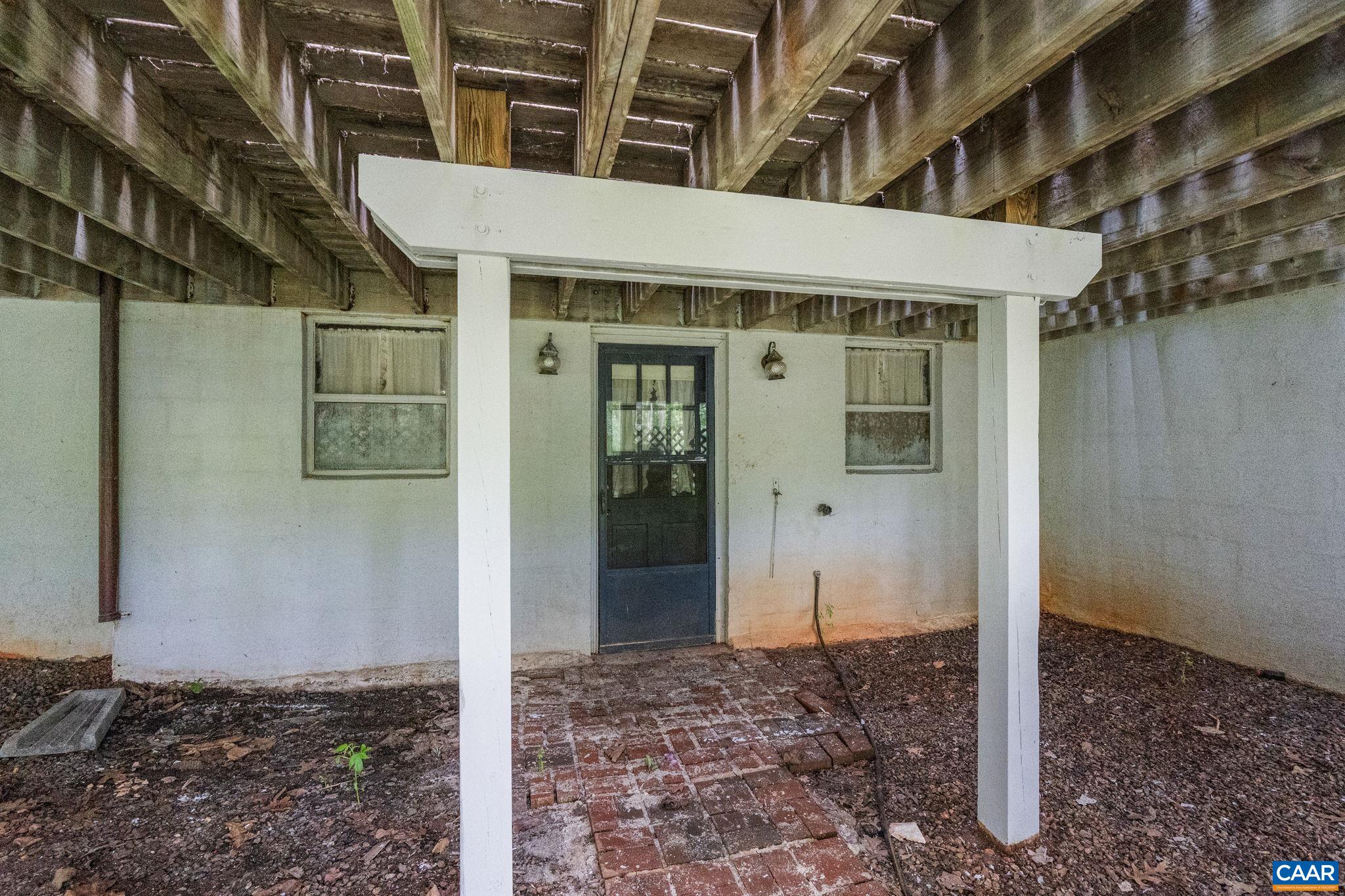 2175 Fray Road Ruckersville, VA 22968 - Photo 53 of 75 a view of a brick house with a tree