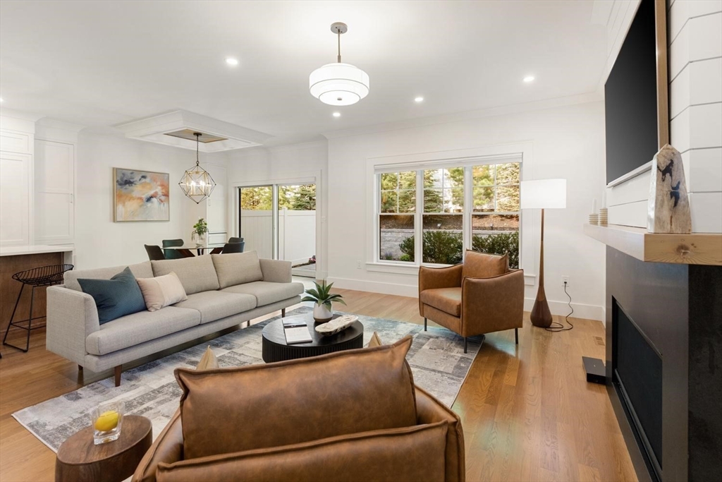 a living room with furniture fireplace and a flat screen tv