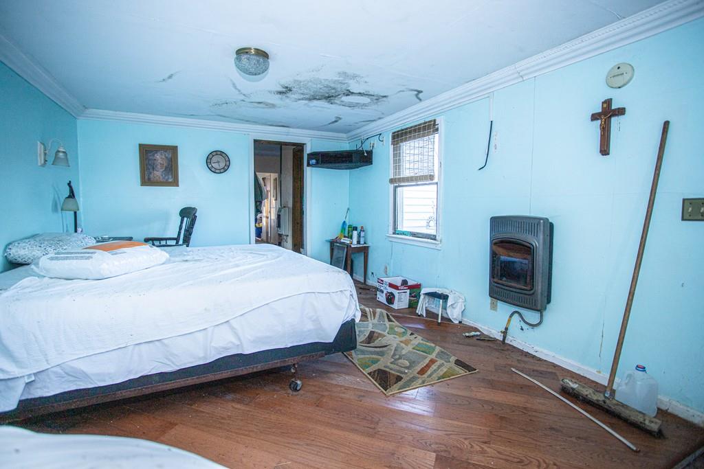 75 Cobb Hill Road Phillipston, MA 01331 - Photo 16 of 42 a bedroom with a bed and a flat tv screen on dresser