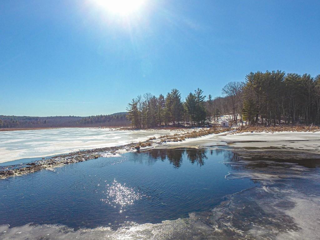 75 Cobb Hill Road Phillipston, MA 01331 - Photo 3 of 42 a view of a lake with beach and small space
