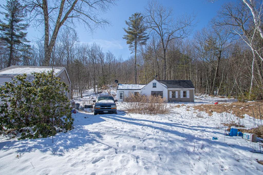 75 Cobb Hill Road Phillipston, MA 01331 - Photo 5 of 42 a view of a house with a yard covered in snow