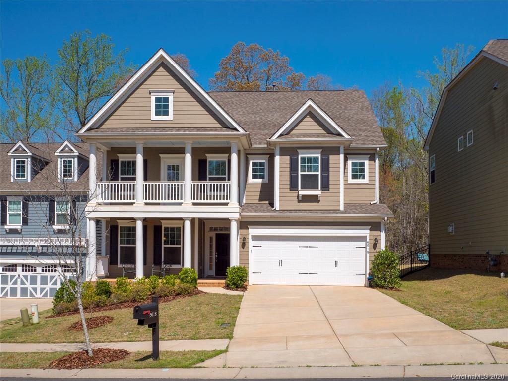 6018 Fallondale Road Waxhaw, NC 28173 - Photo 1 of 48 a front view of a house with garden