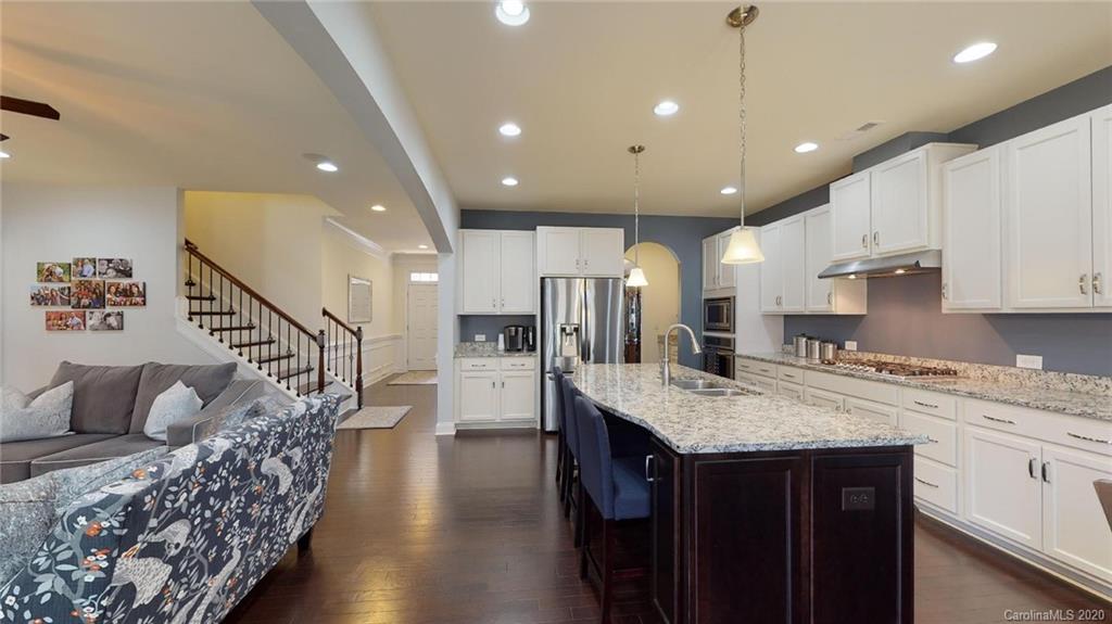 6018 Fallondale Road Waxhaw, NC 28173 - Photo 12 of 48 a kitchen with counter top space cabinets and refrigerator