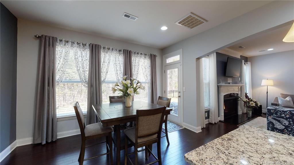6018 Fallondale Road Waxhaw, NC 28173 - Photo 15 of 48 a view of a dining room with furniture and wooden floor