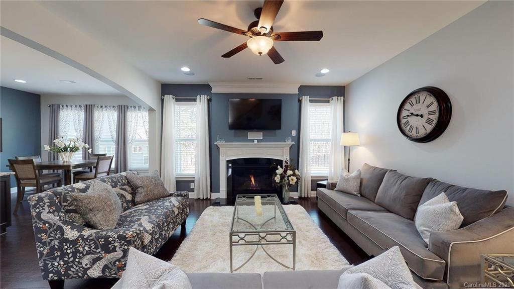 6018 Fallondale Road Waxhaw, NC 28173 - Photo 17 of 48 a living room with furniture a flat screen tv and a fireplace