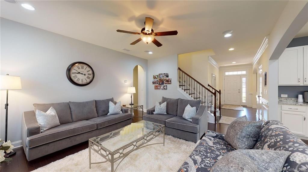 6018 Fallondale Road Waxhaw, NC 28173 - Photo 18 of 48 a living room with furniture and a clock