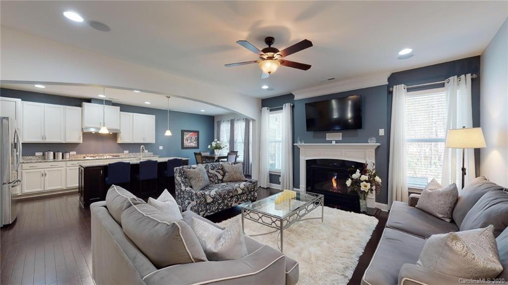 6018 Fallondale Road Waxhaw, NC 28173 - Photo 19 of 48 a living room with furniture and a fireplace
