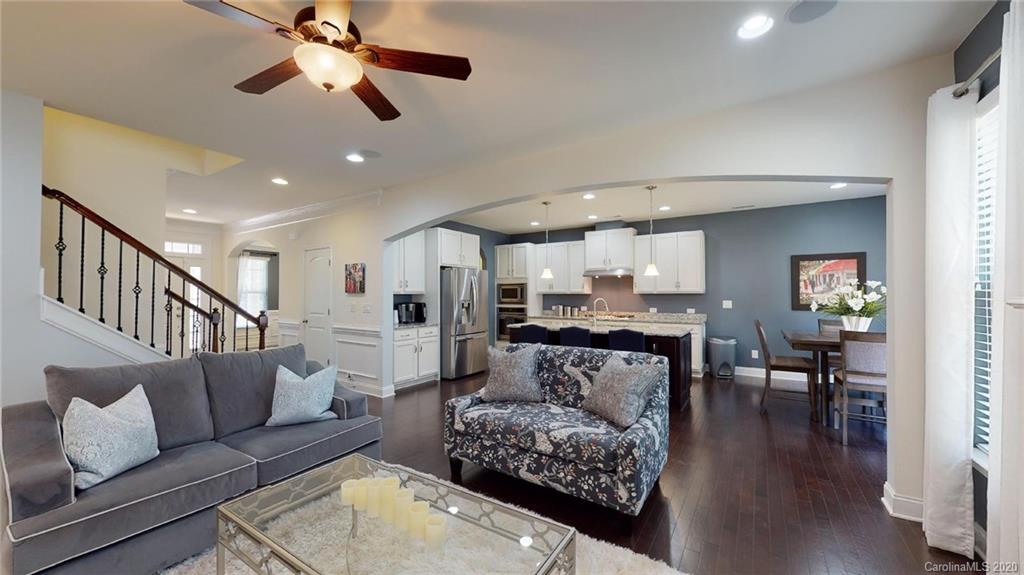 6018 Fallondale Road Waxhaw, NC 28173 - Photo 20 of 48 a living room with furniture and a wooden floor