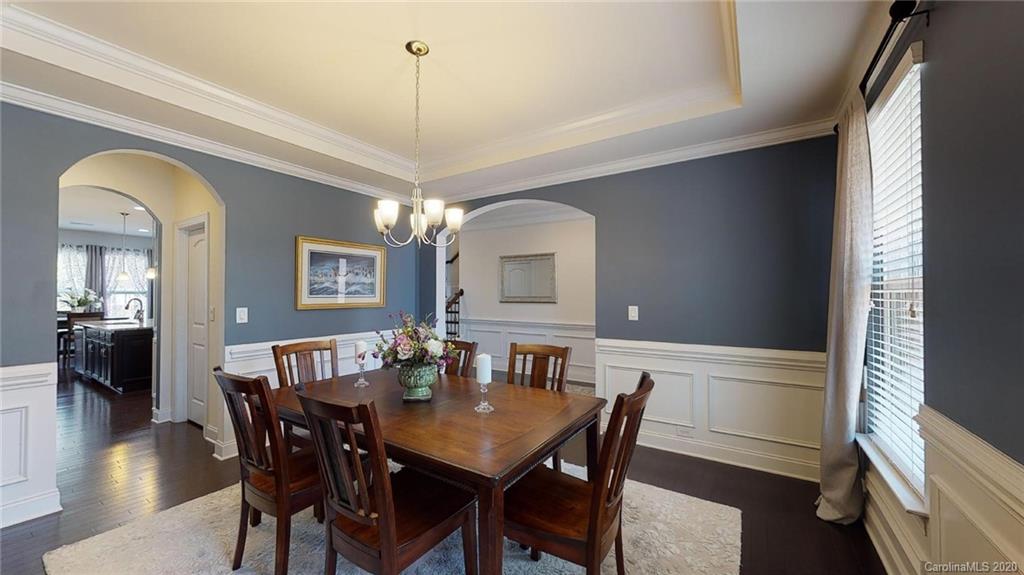 6018 Fallondale Road Waxhaw, NC 28173 - Photo 3 of 48 a view of a dining room with furniture window and wooden floor