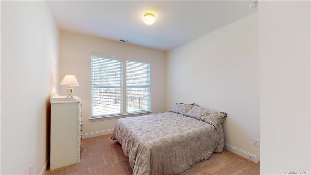 6018 Fallondale Road Waxhaw, NC 28173 - Photo 21 of 48 a bedroom with a bed and a window