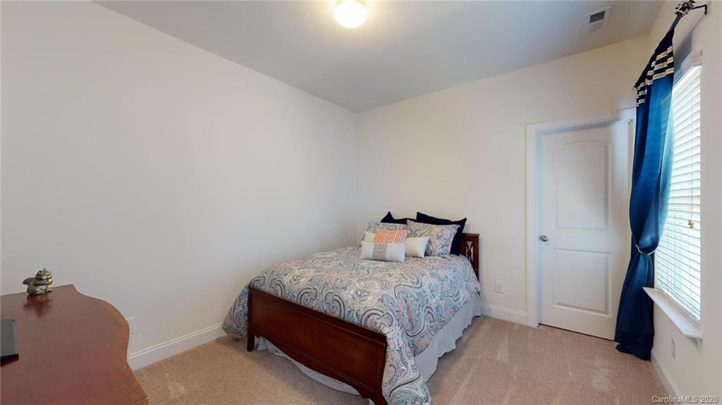 6018 Fallondale Road Waxhaw, NC 28173 - Photo 30 of 48 a bedroom with a bed and a window