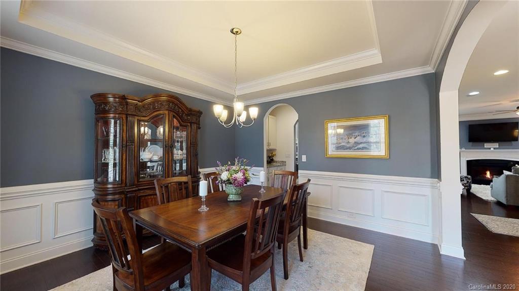 6018 Fallondale Road Waxhaw, NC 28173 - Photo 4 of 48 a view of a dining room with furniture and wooden floor