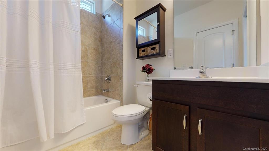 6018 Fallondale Road Waxhaw, NC 28173 - Photo 32 of 48 a bathroom with a sink toilet and shower