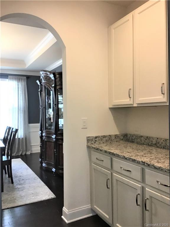 6018 Fallondale Road Waxhaw, NC 28173 - Photo 5 of 48 a kitchen with a refrigerator and cabinets