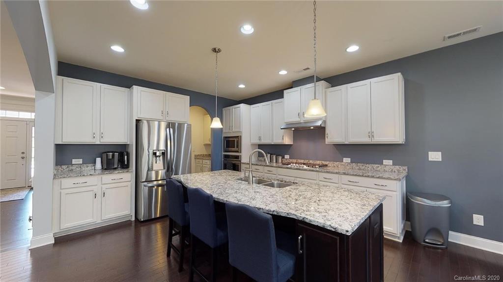 6018 Fallondale Road Waxhaw, NC 28173 - Photo 7 of 48 a kitchen with a center island appliances and cabinets