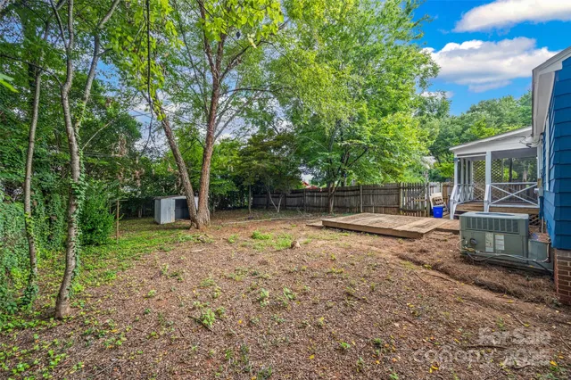 a view of backyard with green space