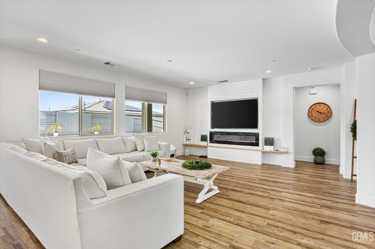 Undisclosed Address Bakersfield, CA 93314 - Photo 16 of 43 a living room with furniture and a flat screen tv