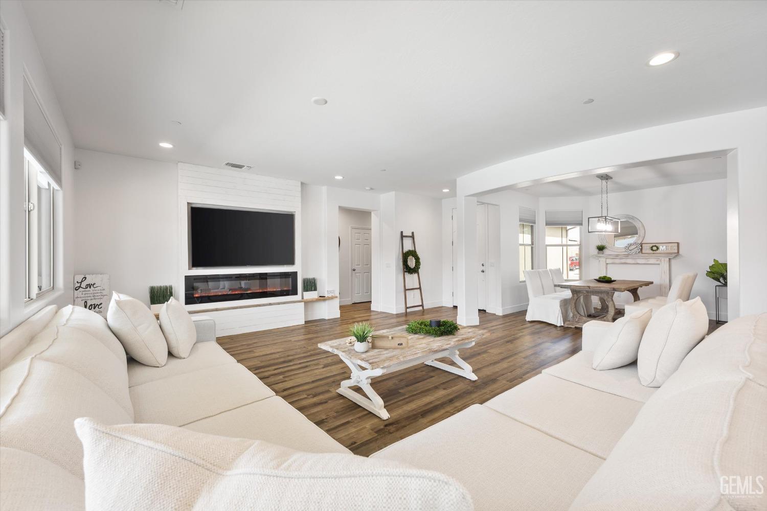 Undisclosed Address Bakersfield, CA 93314 - Photo 19 of 43 a living room with furniture and a flat screen tv