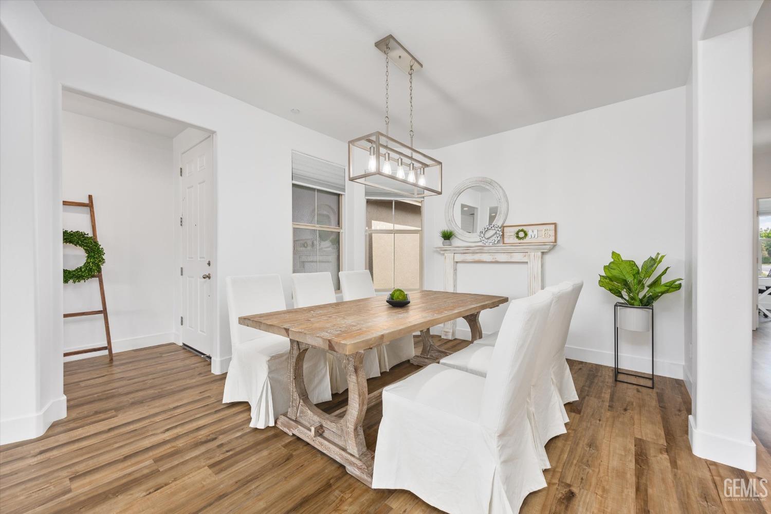 Undisclosed Address Bakersfield, CA 93314 - Photo 20 of 43 a view of a dining room with furniture window and wooden floor
