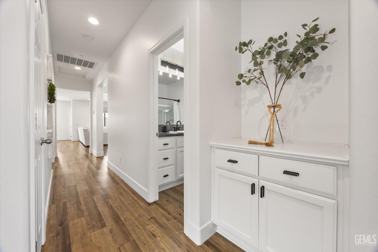 Undisclosed Address Bakersfield, CA 93314 - Photo 23 of 43 a view of a hallway with closet and wooden floor