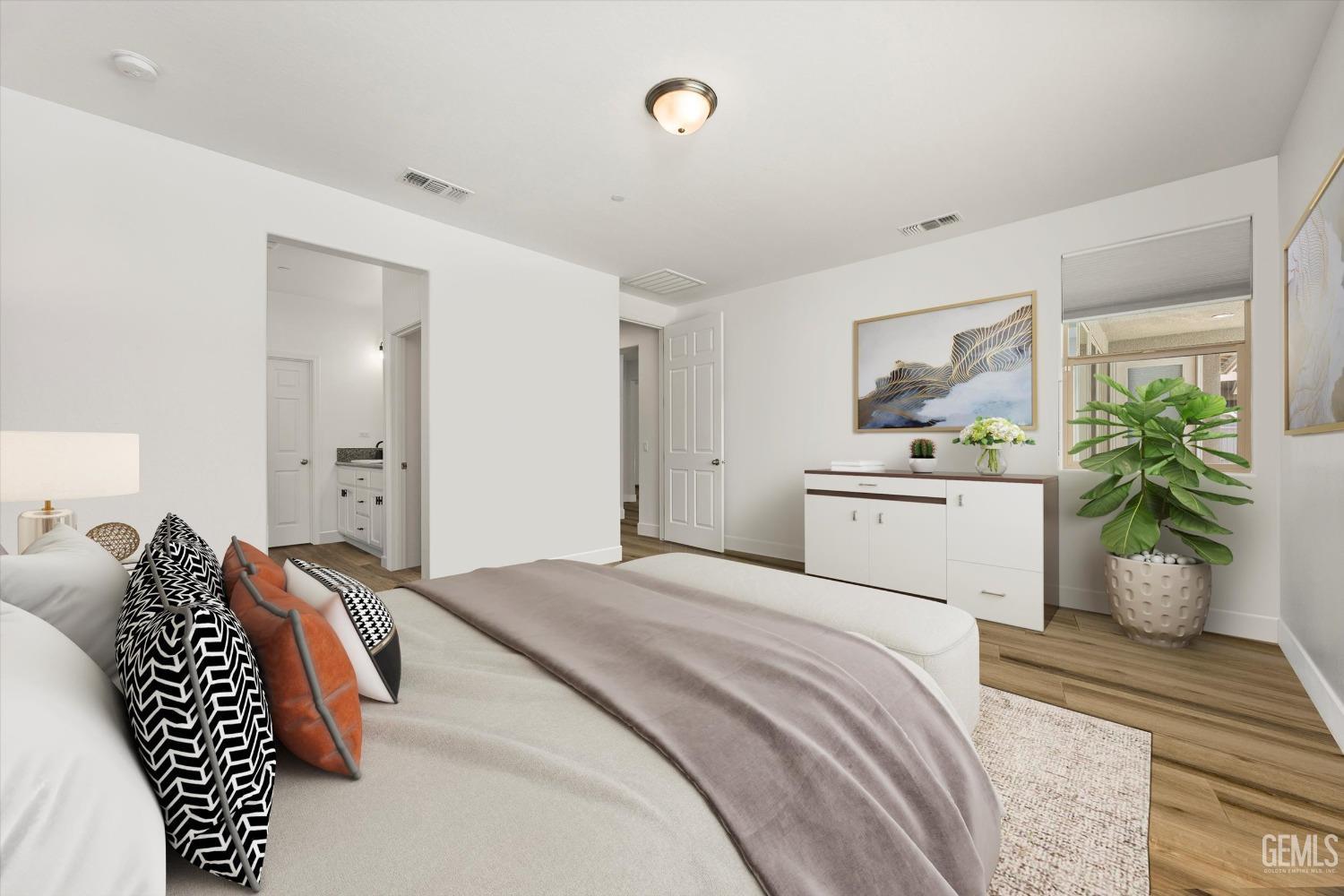 Undisclosed Address Bakersfield, CA 93314 - Photo 25 of 43 a bedroom with a bed and a couch