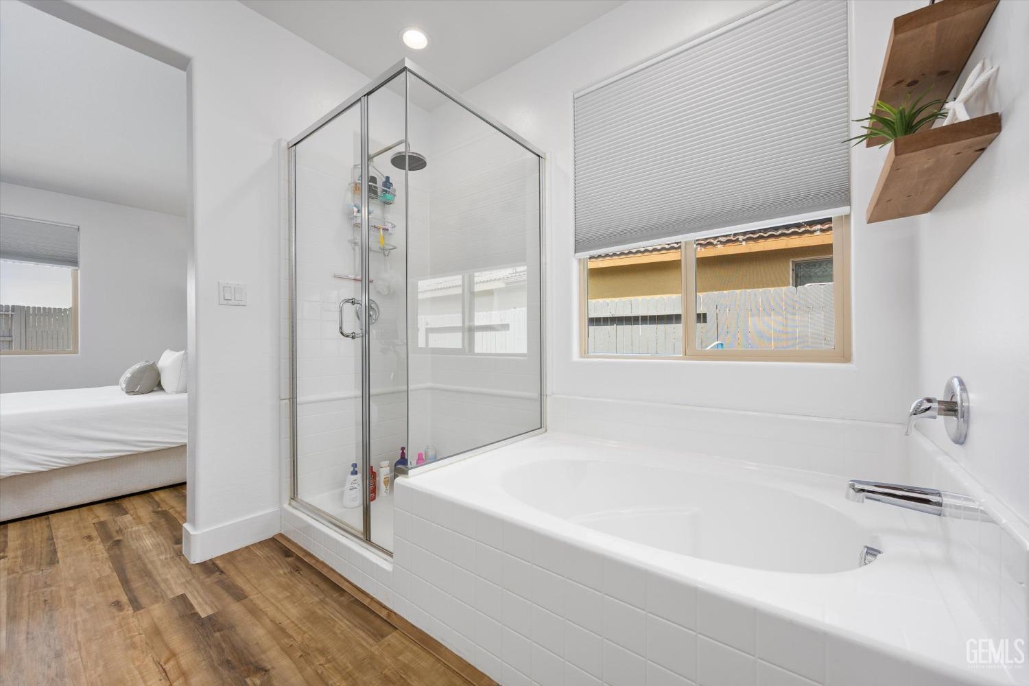 Undisclosed Address Bakersfield, CA 93314 - Photo 28 of 43 a bathroom with a bathtub and a shower