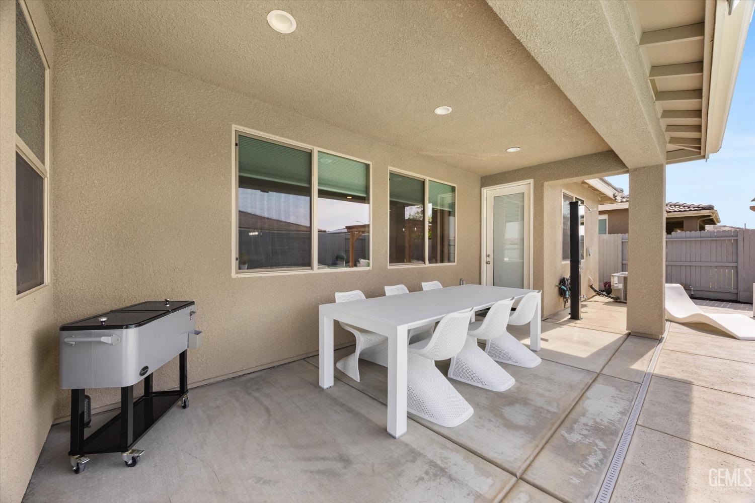 Undisclosed Address Bakersfield, CA 93314 - Photo 34 of 43 a large room with a table and chairs