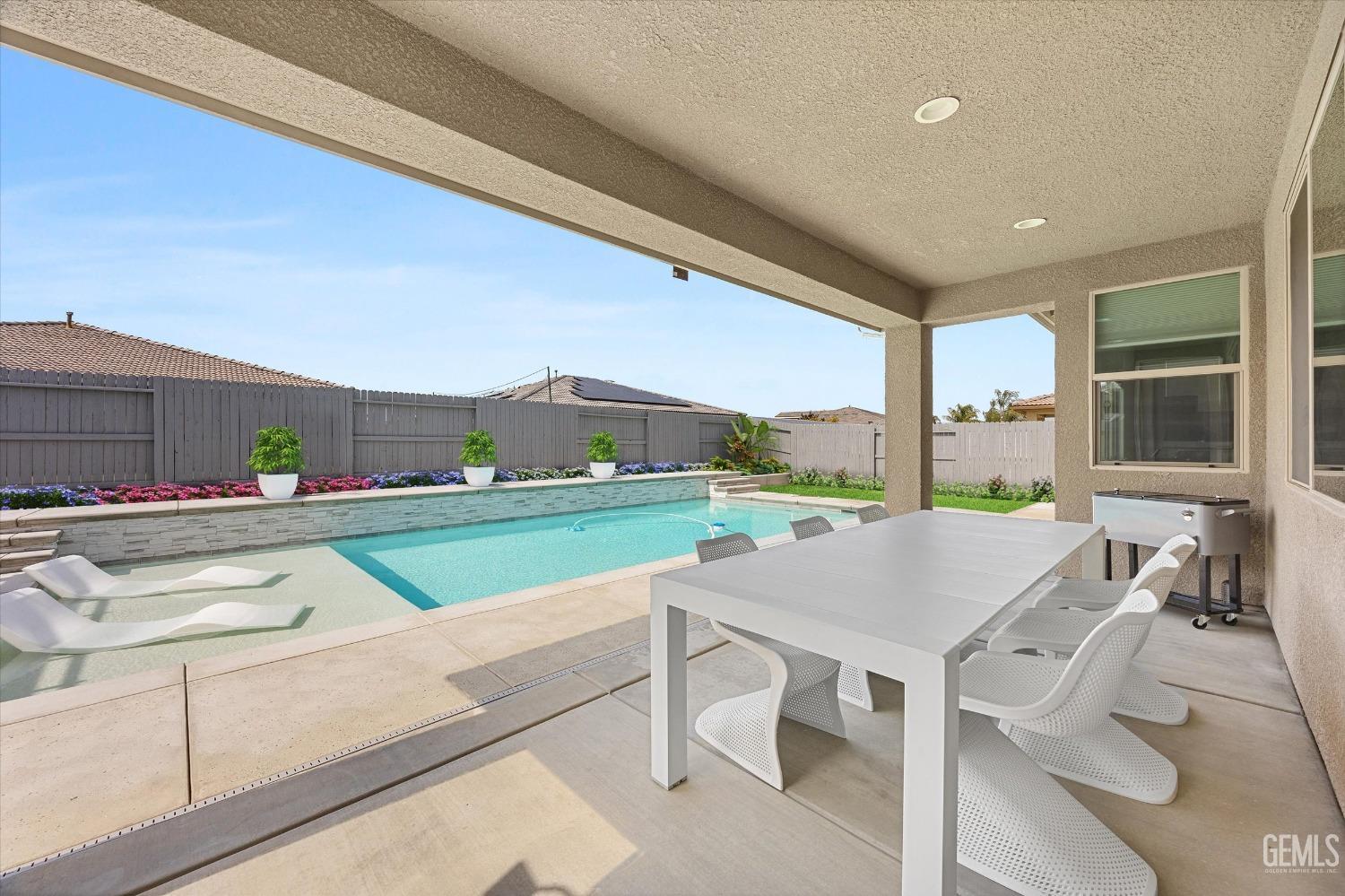 Undisclosed Address Bakersfield, CA 93314 - Photo 35 of 43 a view of a patio with a table and chairs