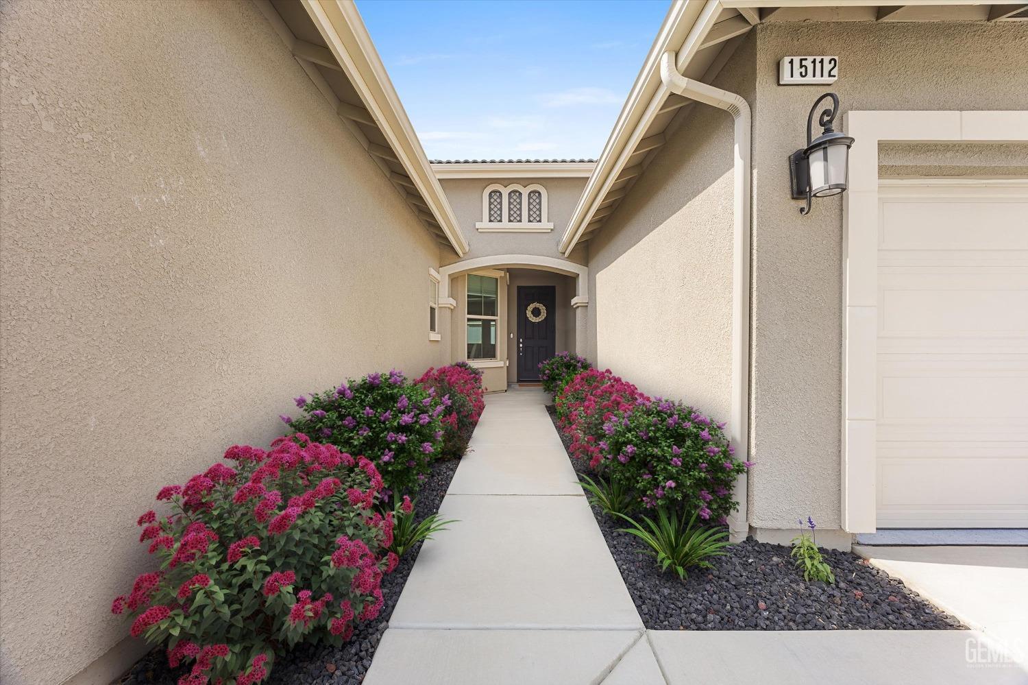 Undisclosed Address Bakersfield, CA 93314 - Photo 4 of 43 a view of a house with flower pots