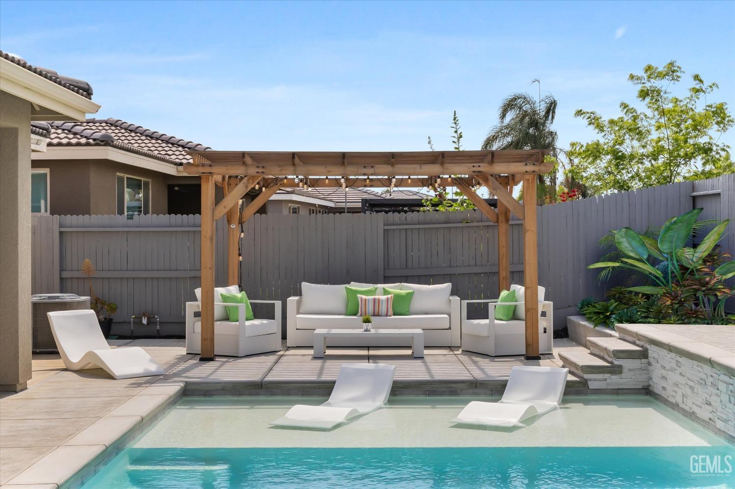 Undisclosed Address Bakersfield, CA 93314 - Photo 41 of 43 a view of house with patio outdoor seating and covered with tall trees