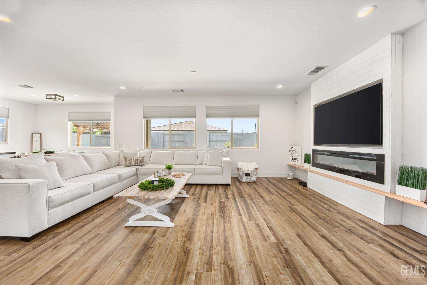 Undisclosed Address Bakersfield, CA 93314 - Photo 5 of 43 a living room with furniture and a flat screen tv